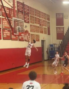 Masuk freshman Tyler Newsome throws down a massive dunk against league rival New Fairfield
