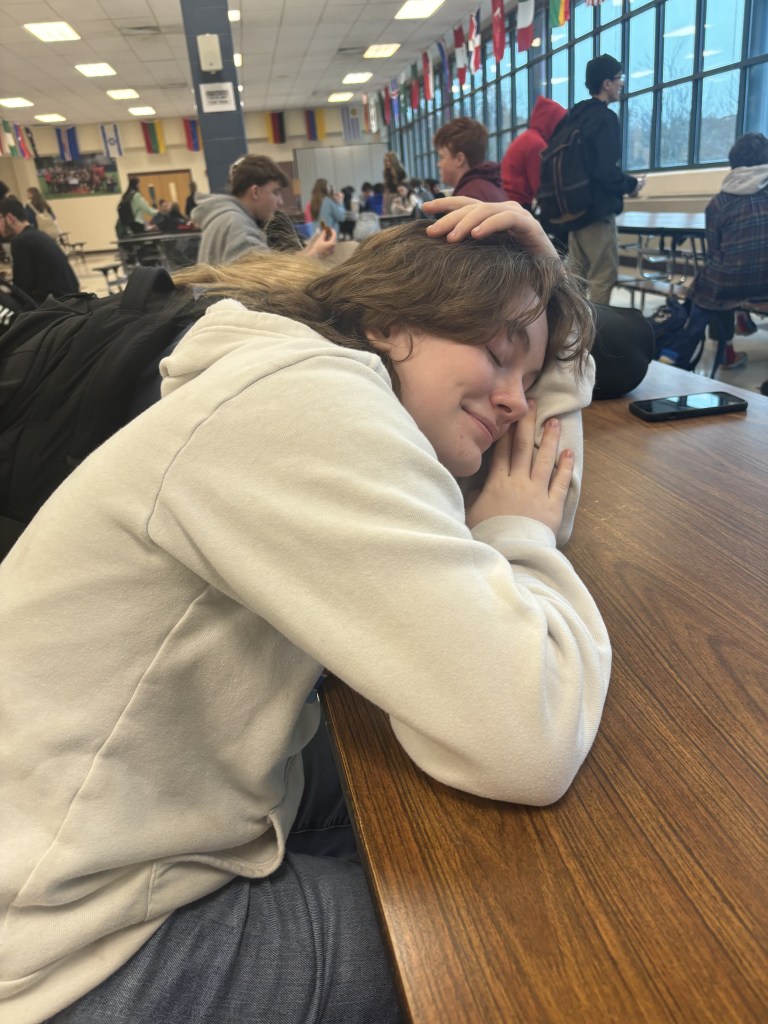 Masuk Student Joy Bray catching up on some sleep during lunch